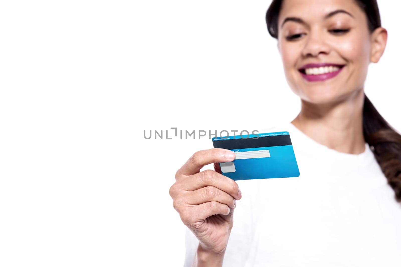 Smiling young woman checking her cash card