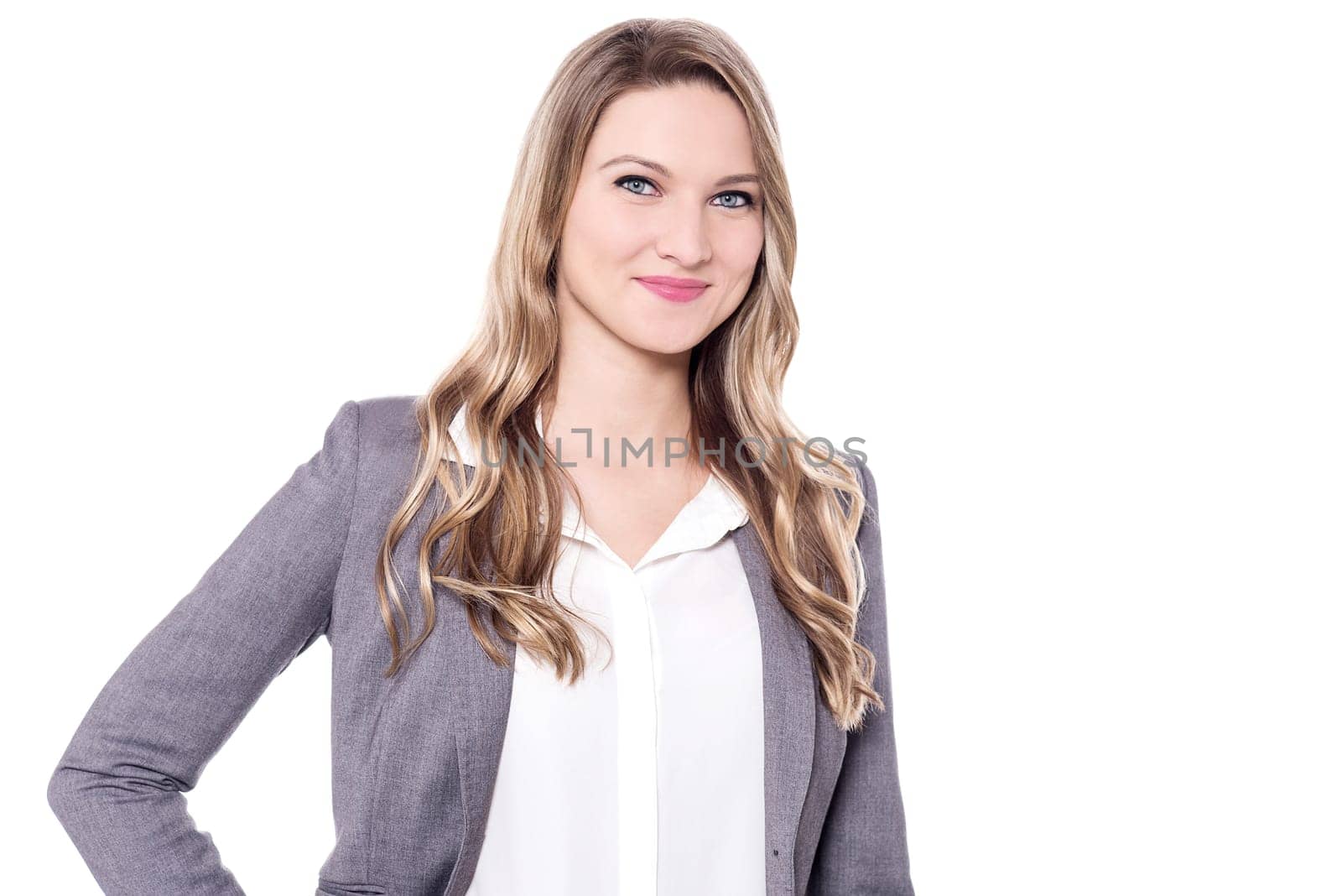 Smiling young woman posing to camera over white background