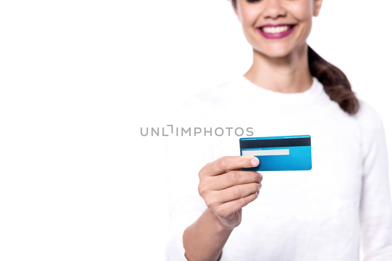 Cropped image of a young woman displaying her cash card