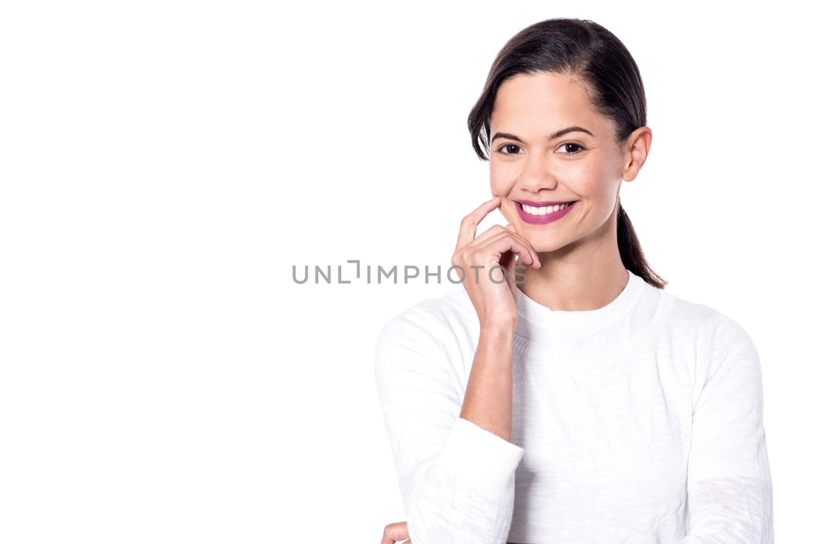 Studio shot of a pretty woman with hand on cheek