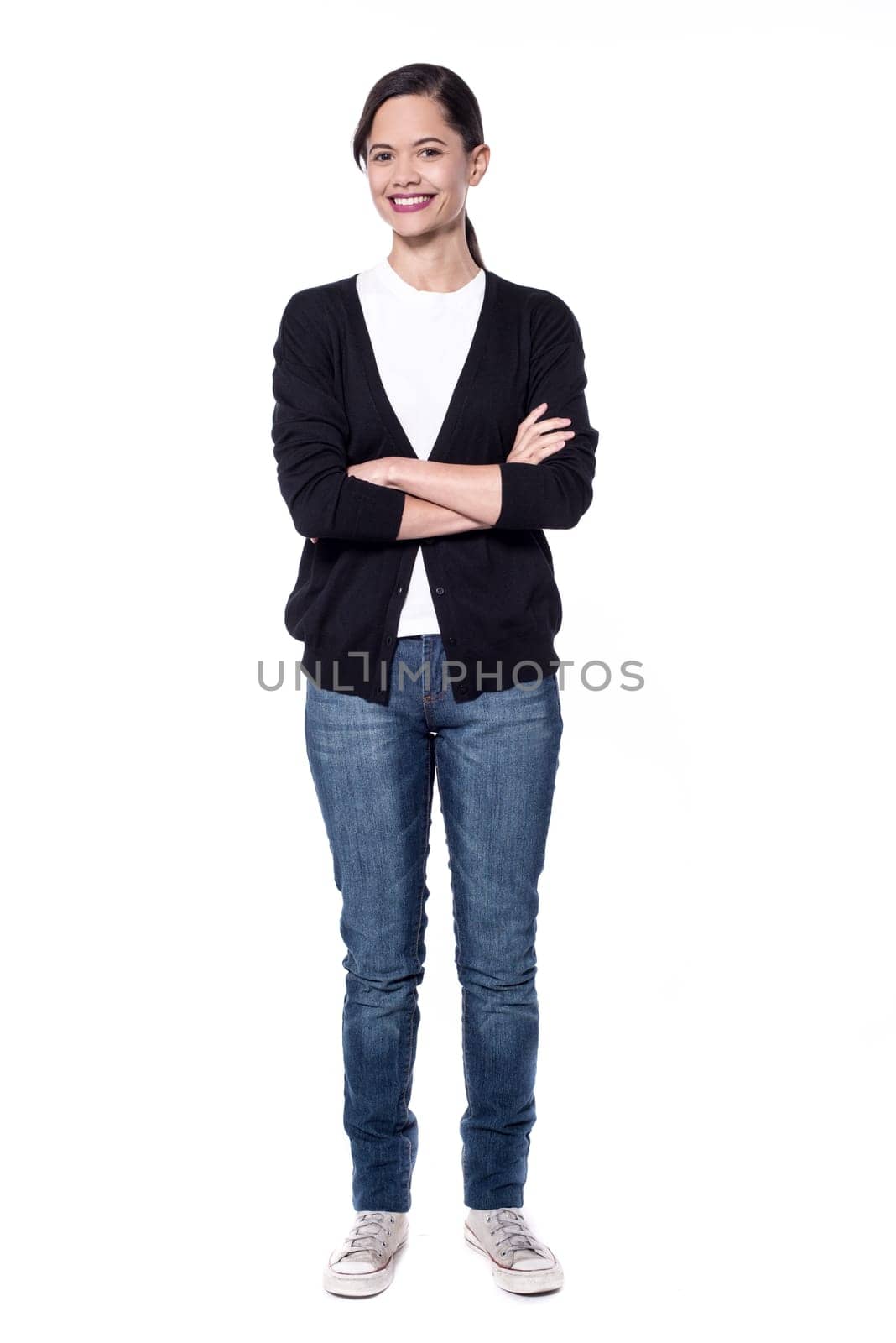 Woman in trendy wear posing with crossed arms