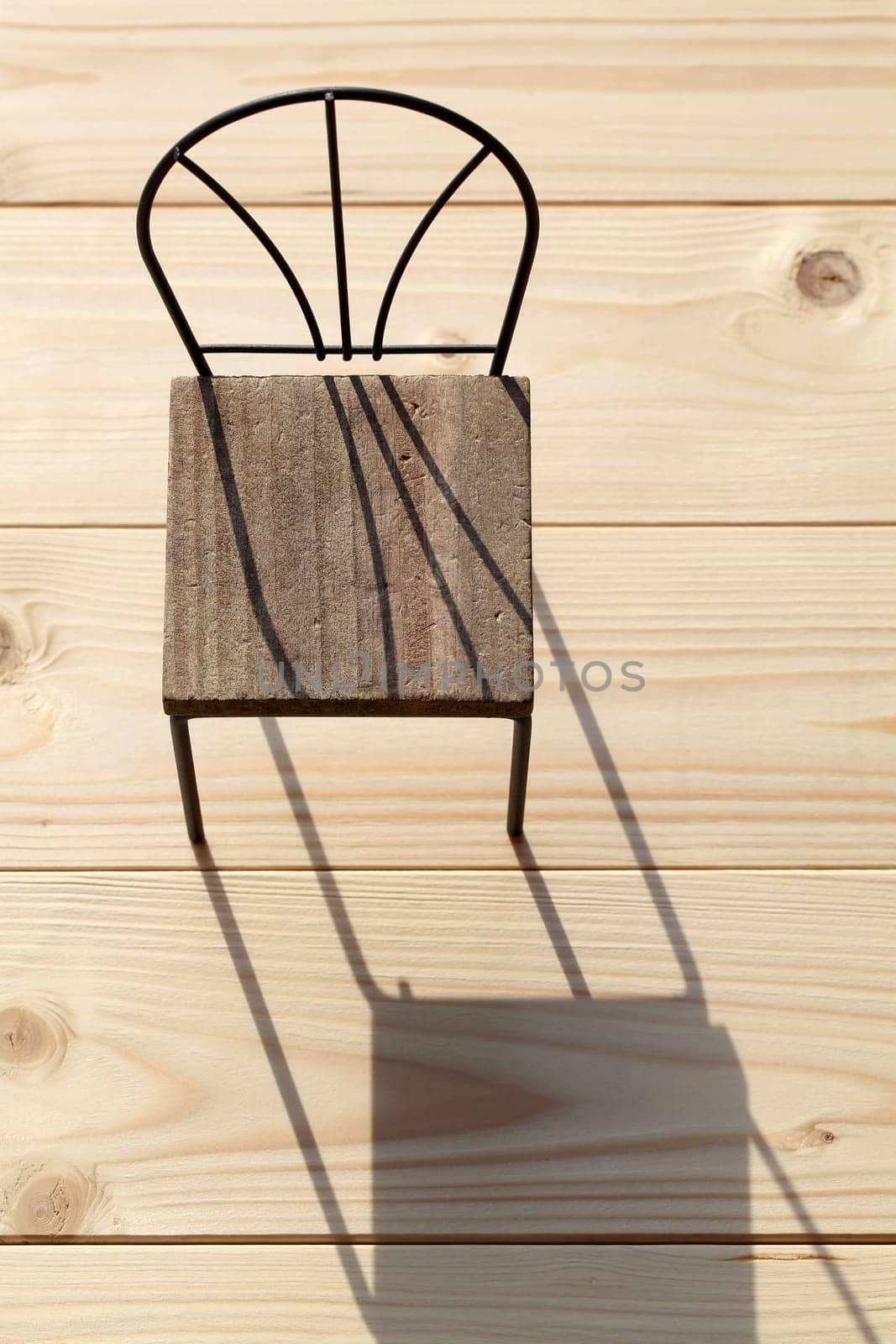 chair and shadow on the wooden floor