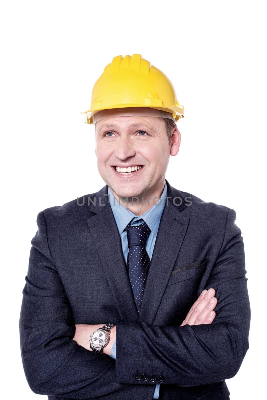 Male architect looking away with folded arms