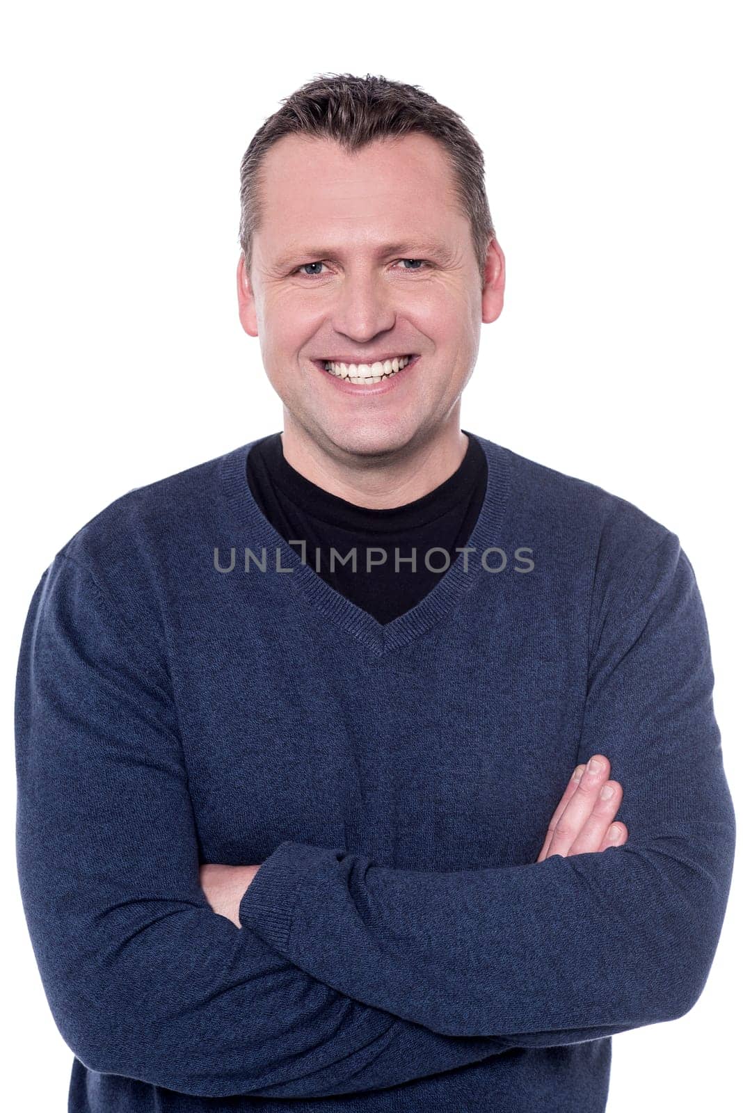 Close up shot of happy man with crossed arms