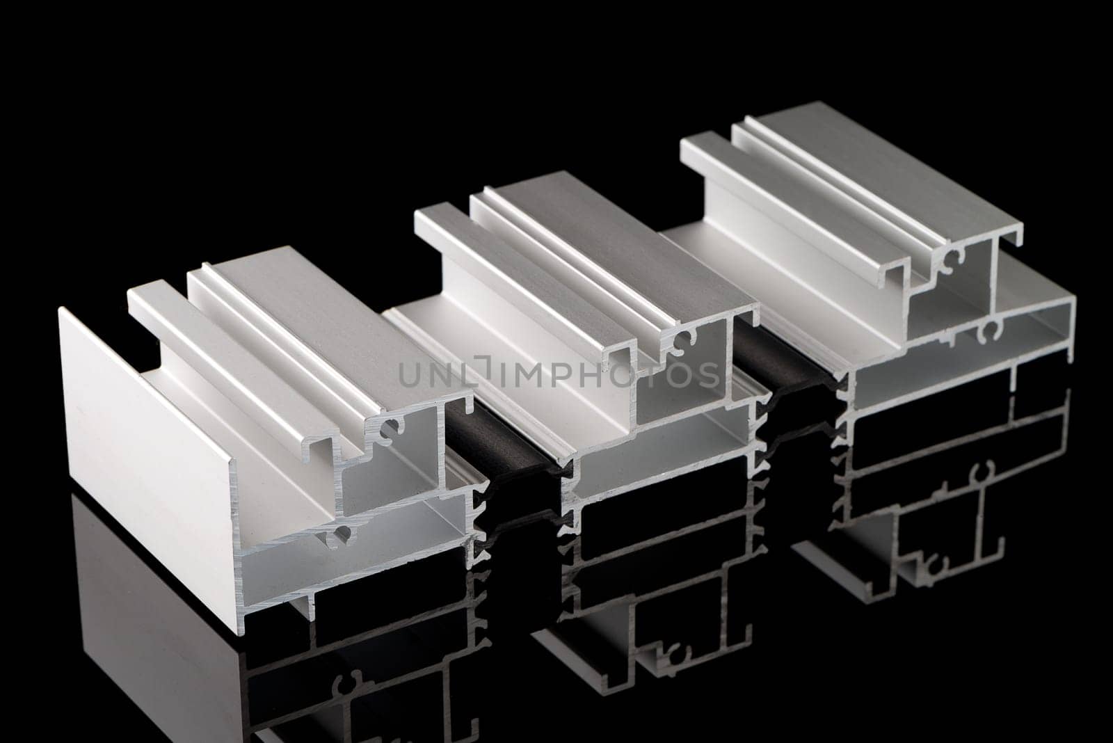 Aluminium profile sample isolated on black background.