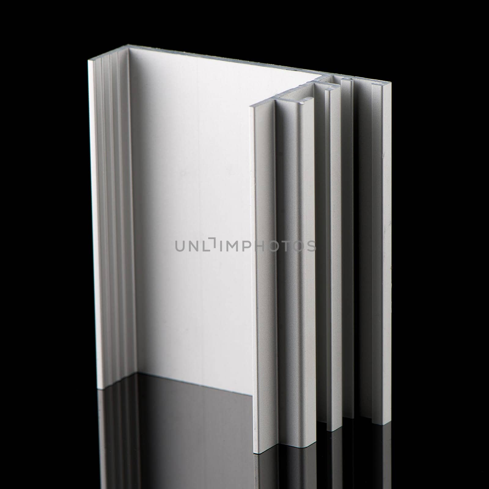 Aluminium profile sample isolated on black background.