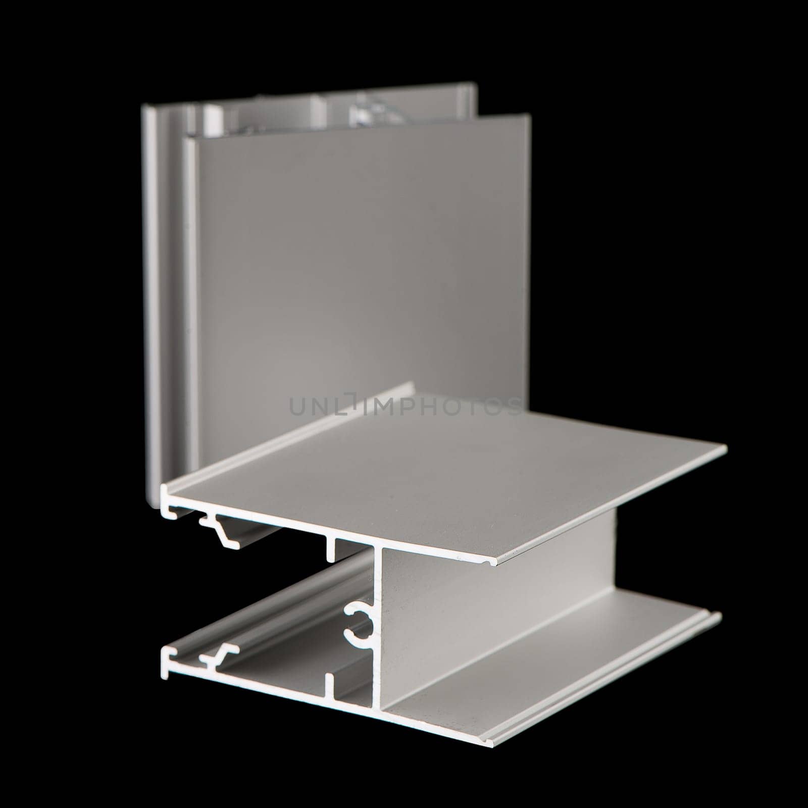 Aluminium profile sample isolated on black background.