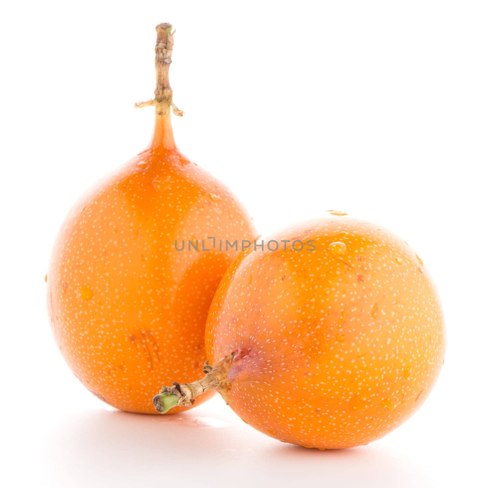 Passion fruit maracuja granadilla on white background.