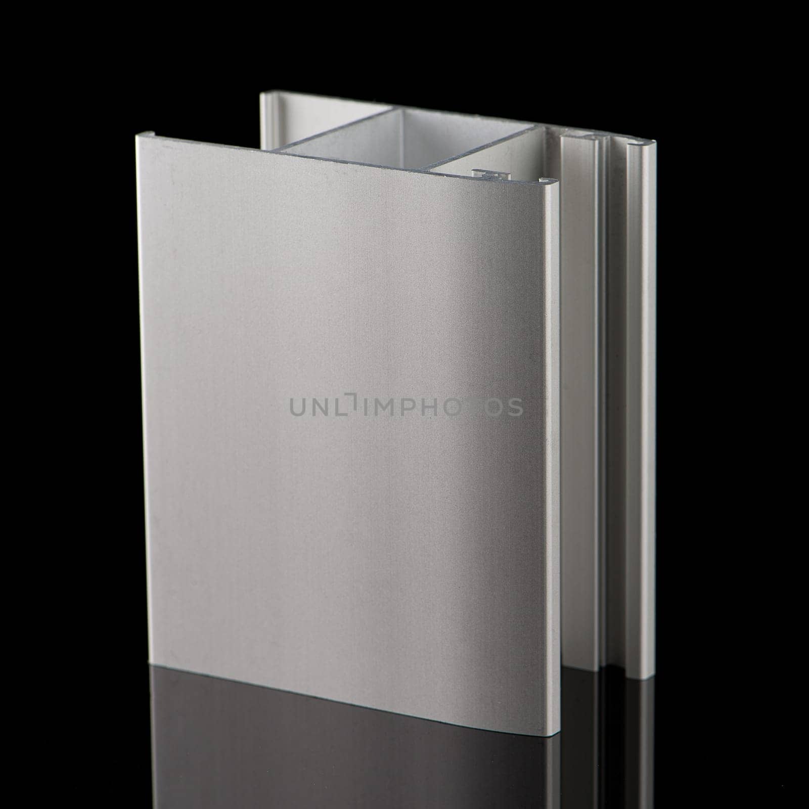 Aluminium profile sample isolated on black background.