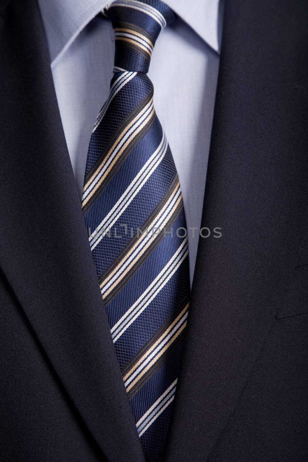detail of a business man suit with blue tie