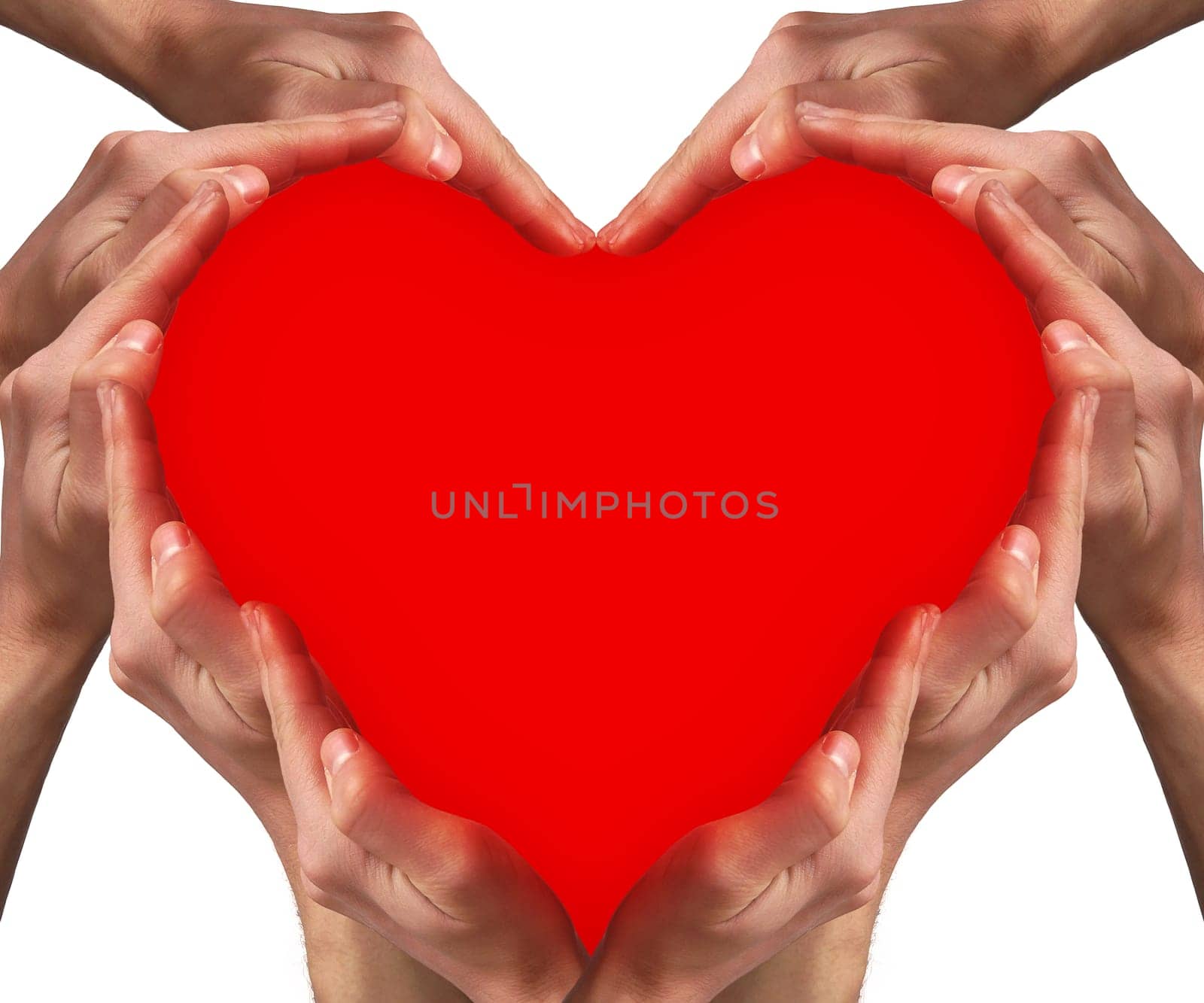 Hands arranged around a red heart shape. Love concept