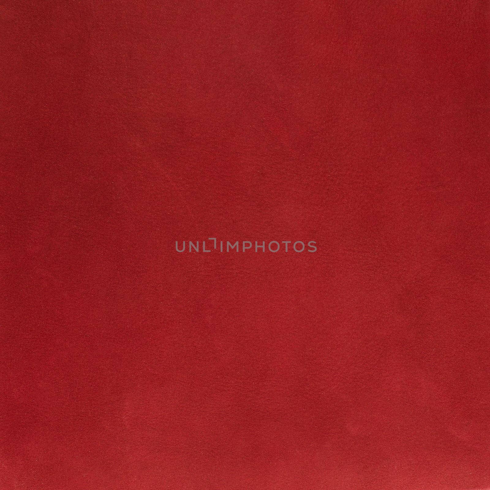 Red leather texture closeup detailed background.