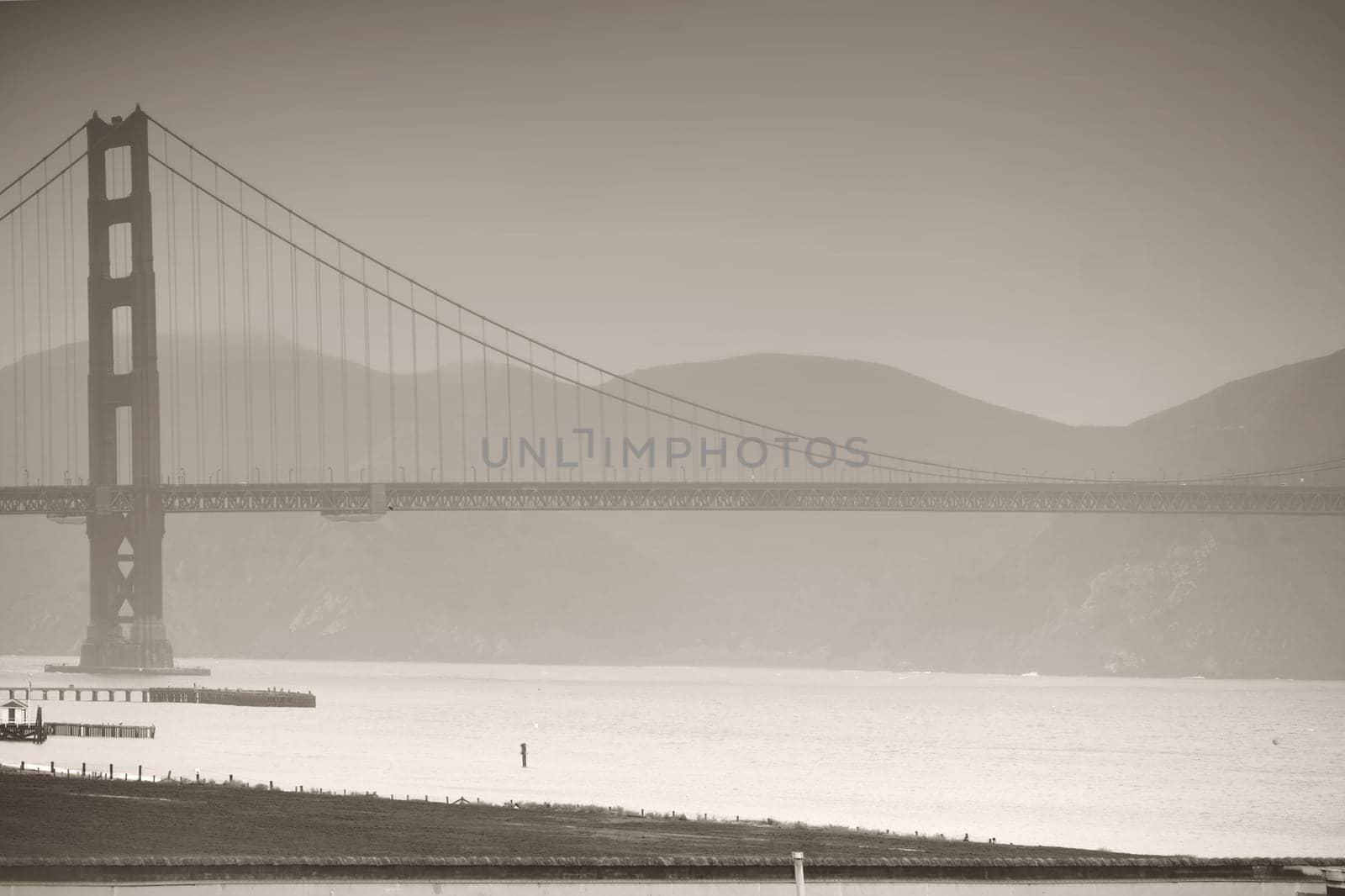 The Golden Gate Bridge in this rainy weather and in monochrome.