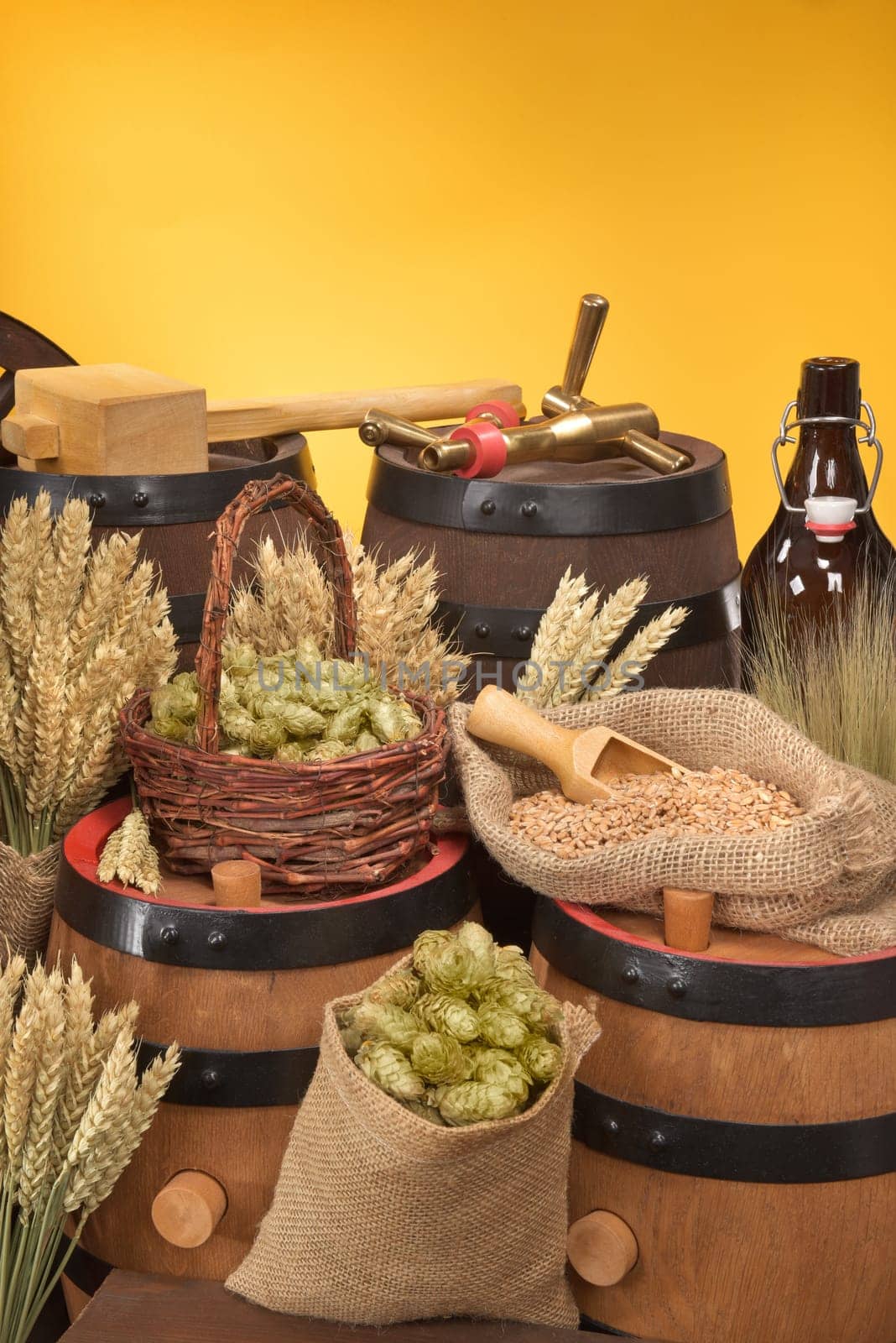 Beer barrels,beer bottle,hammer and tap with wheat,barley,hops and malt