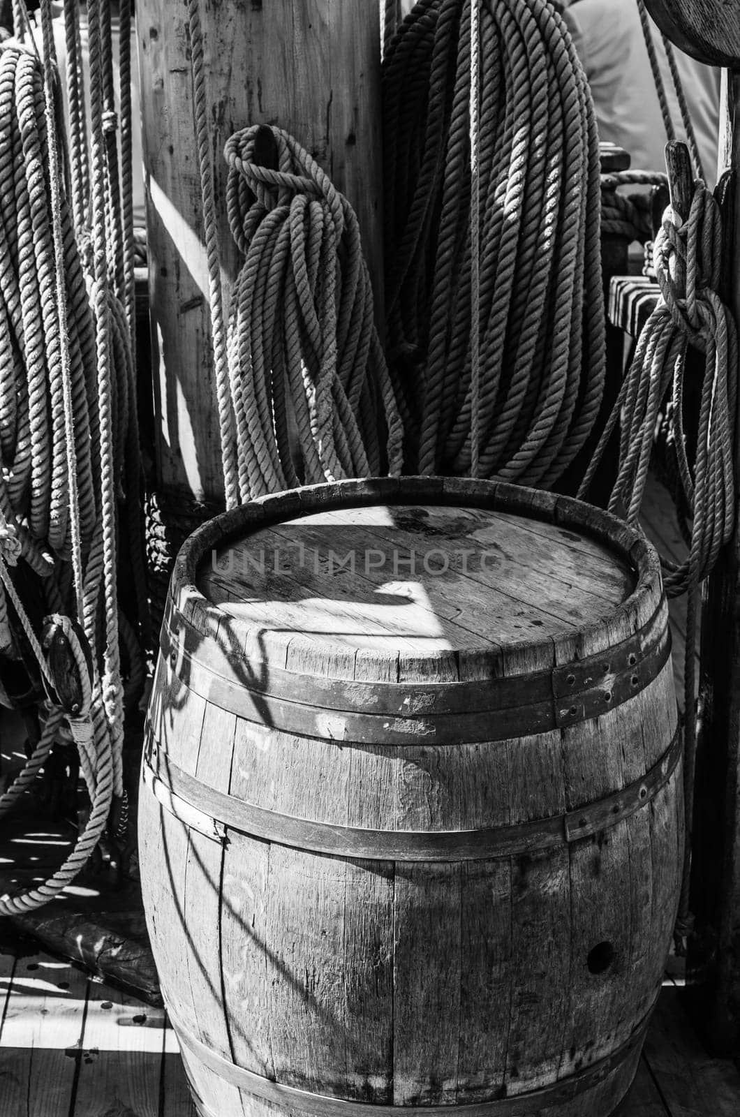 an old wooden barrel on the deck of a sailboat
