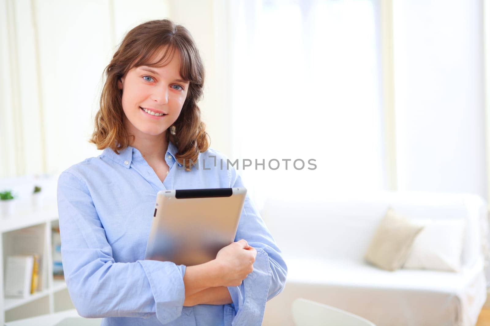 View of a young business woman with a tablet