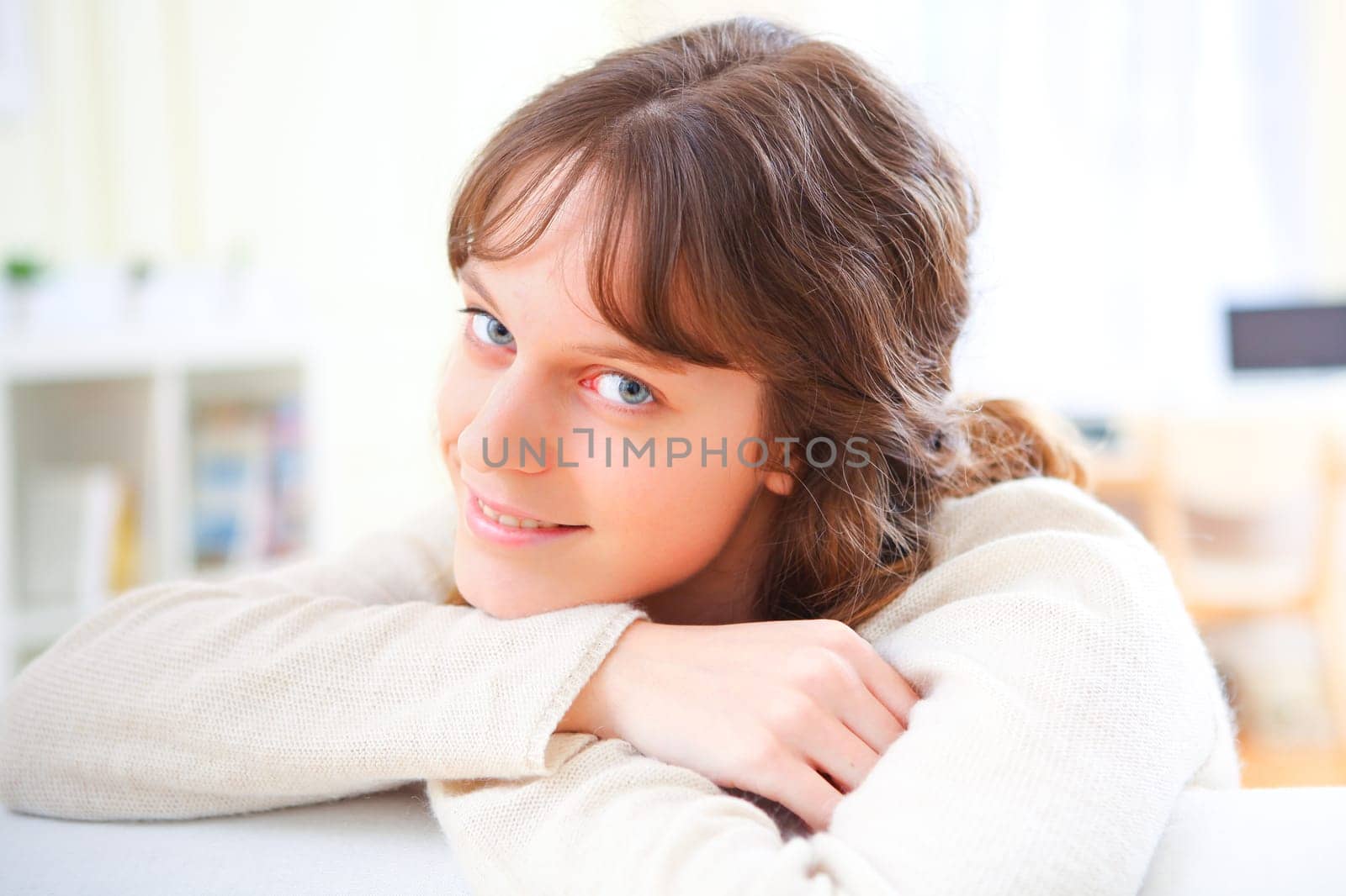View of a young attractive woman relaxing on sofa