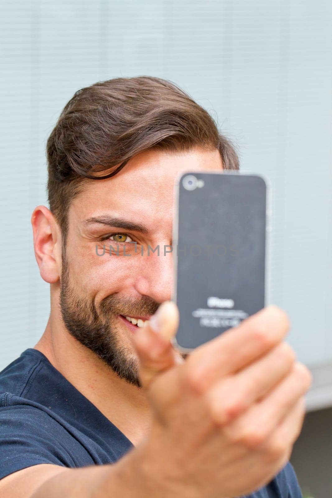 Young man takes a selfie
