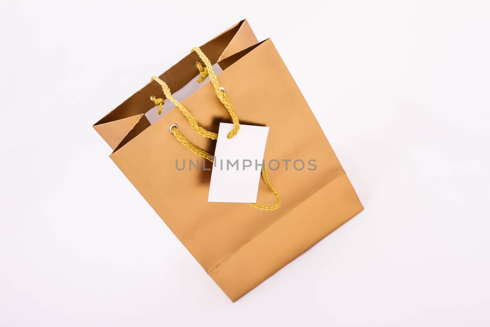 A gold gift bag isolated.