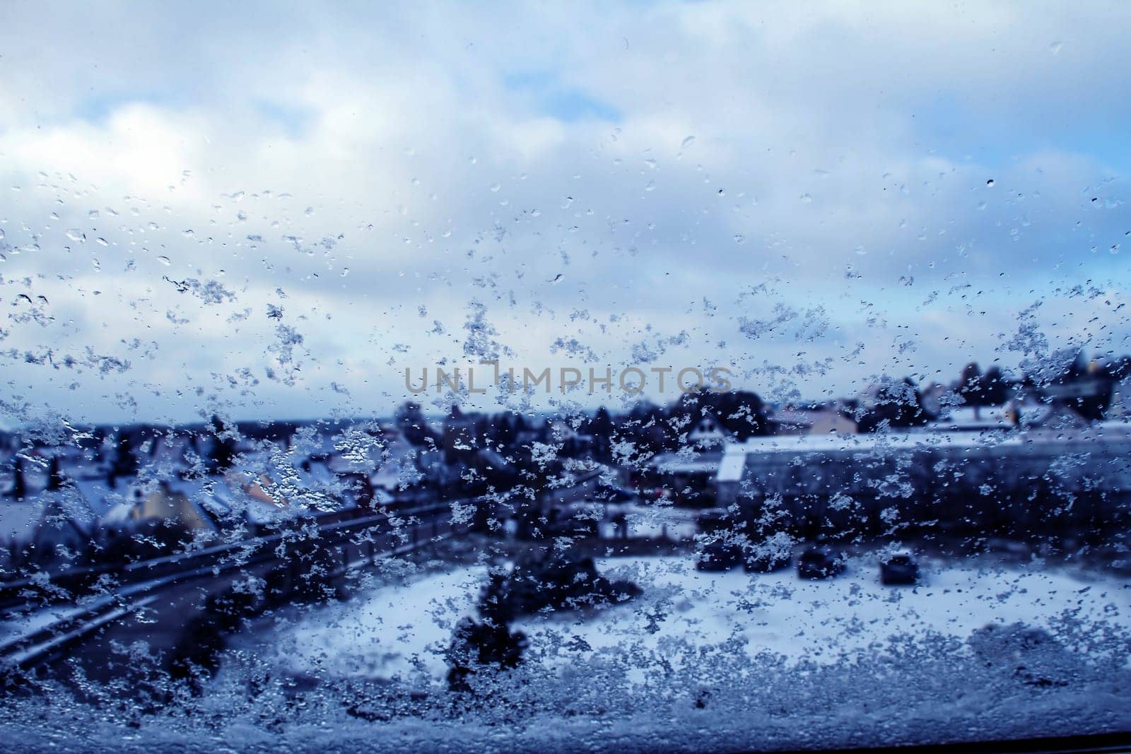 Landscape through a snowy window Wemding, Germany