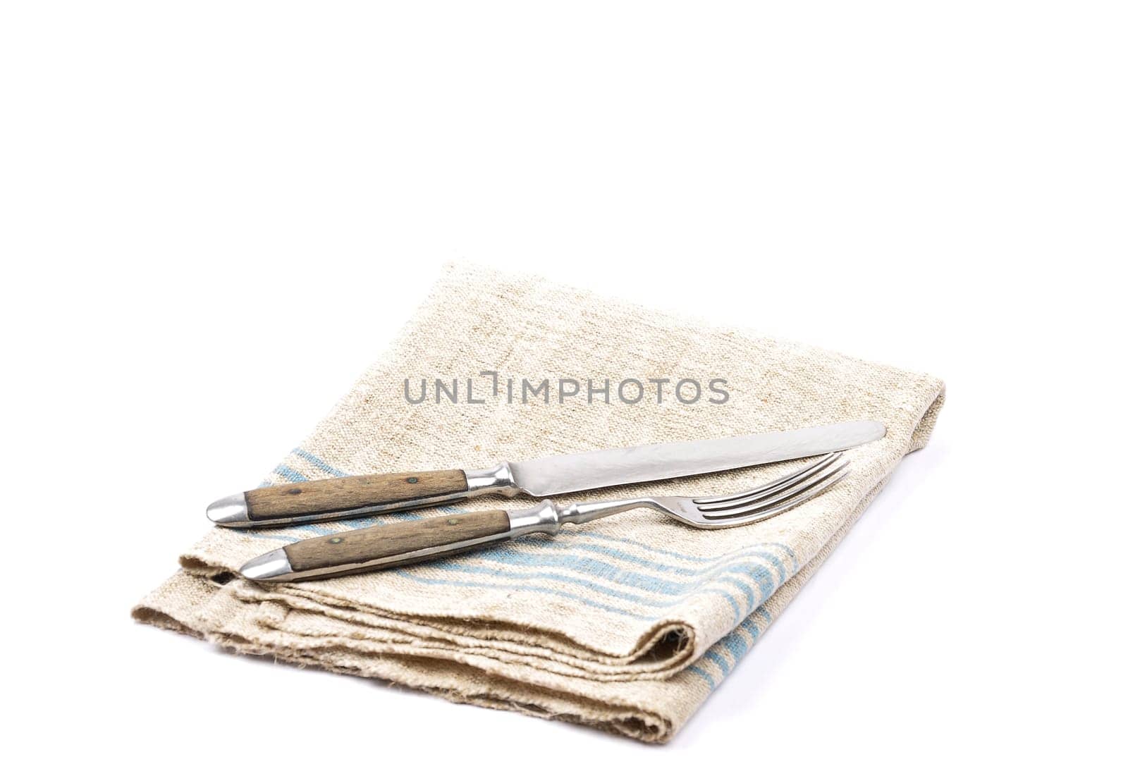 Antique cutlery on linen cloth