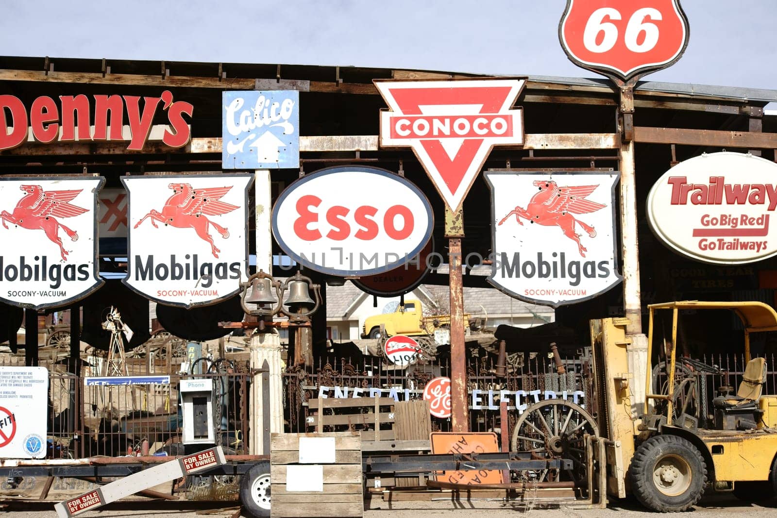 Barstow,United States - December 22,2015: A workshop with a forklift and old vintage and retro signs of various brands on December 22,2015 in Barstow.