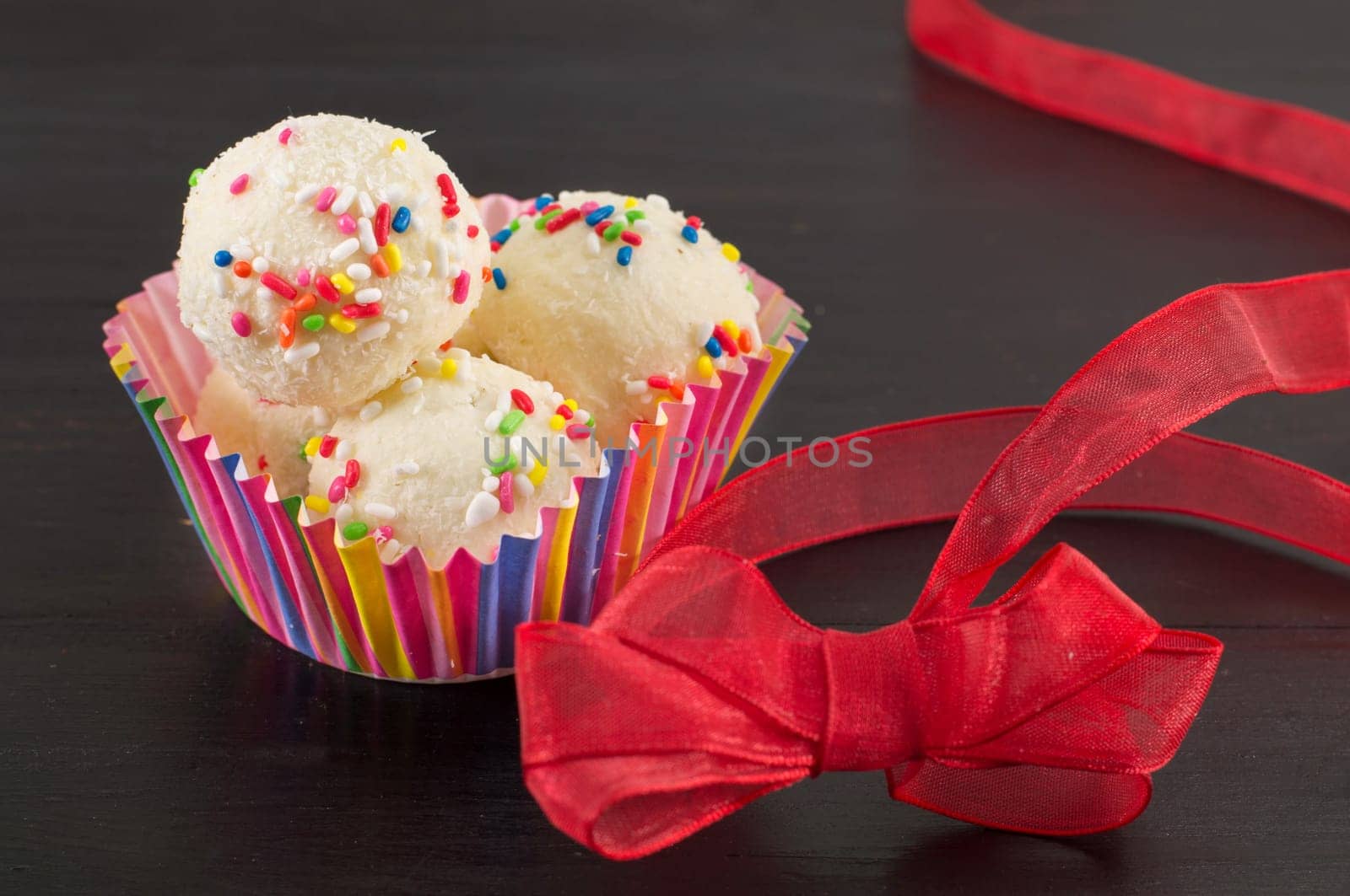 homemade raffaelo balls on dark background