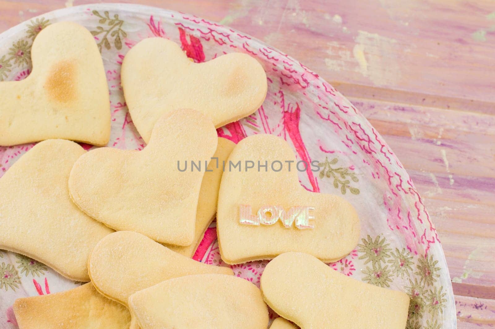 heart shaped biscuits on a decoupage plate