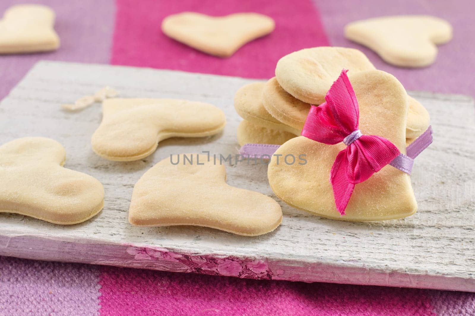 heart shaped biscuits on a cutting board