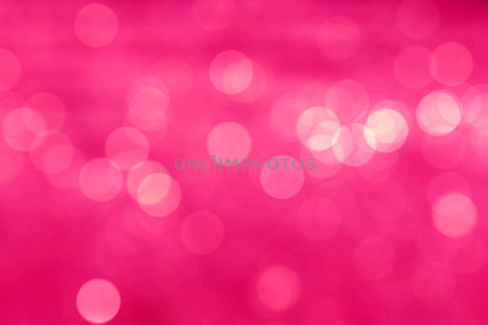 Abstract circular natural light vivid pink bokeh background