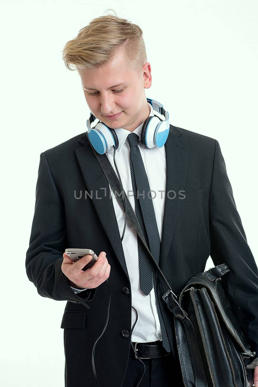 young businessman with blue hadphone and dispatchcase