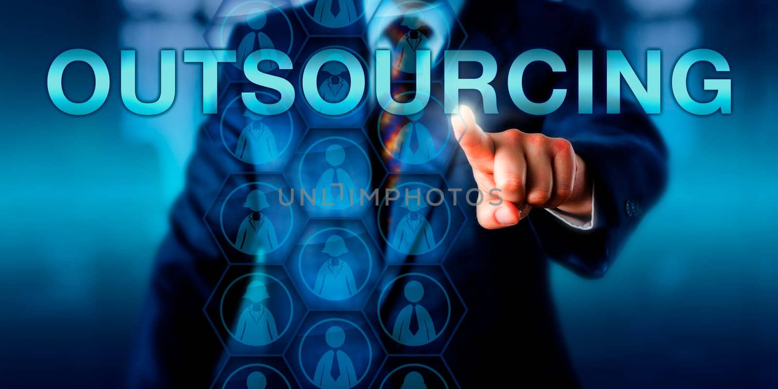 Management consultant touching OUTSOURCING onscreen. Female and male white collar worker icons embedded in a hexagonal planning matrix do represent a pool of outside or offshore professional talent.