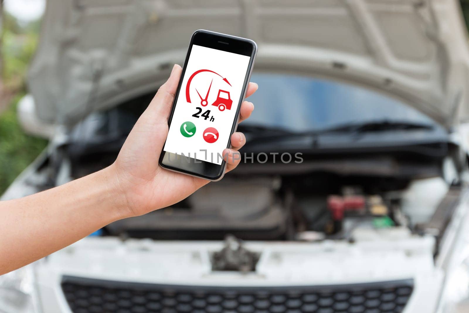 hand holding phone call emergency car service application