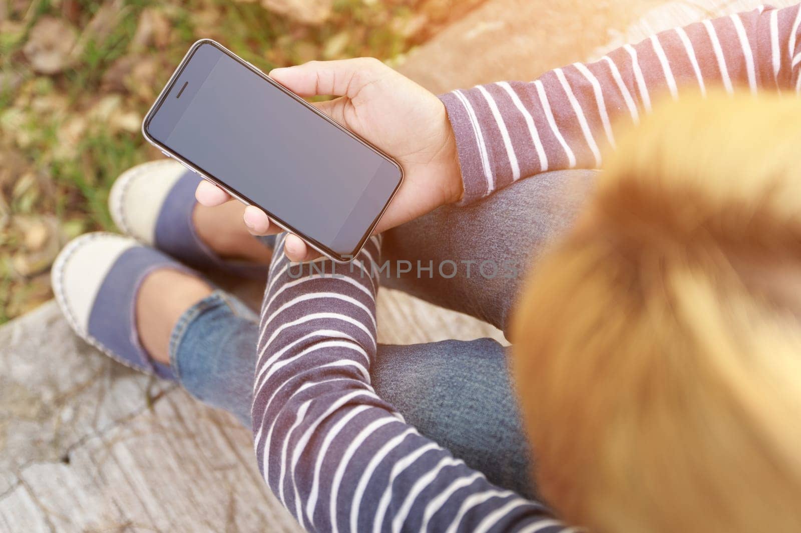 hipster female holding smart phone modern technology
