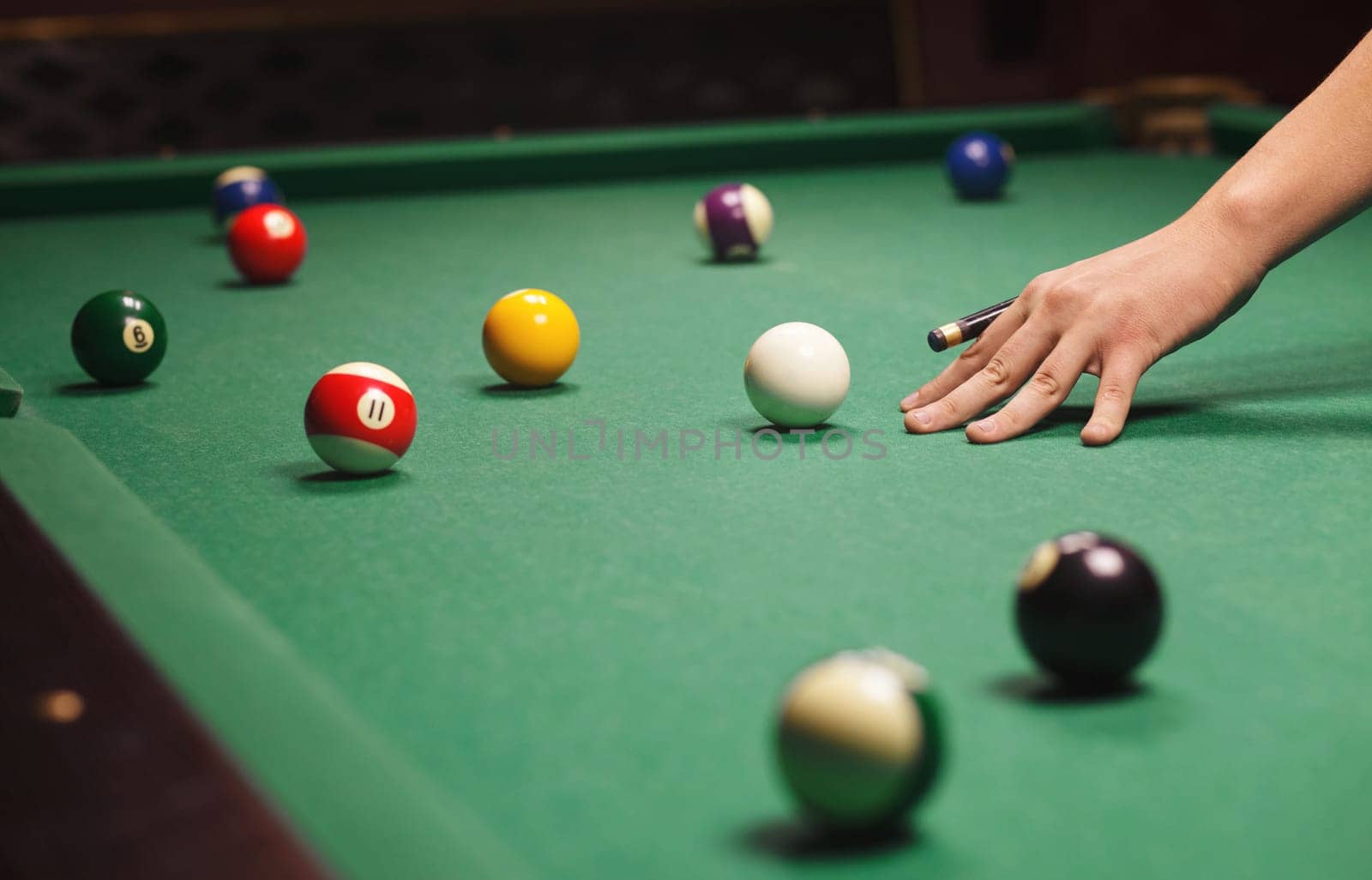 Playing billiard - Close-up shot of a man playing billiard