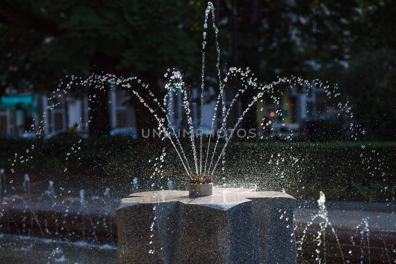 Water stream splashing on ground, Water drops watering, close up