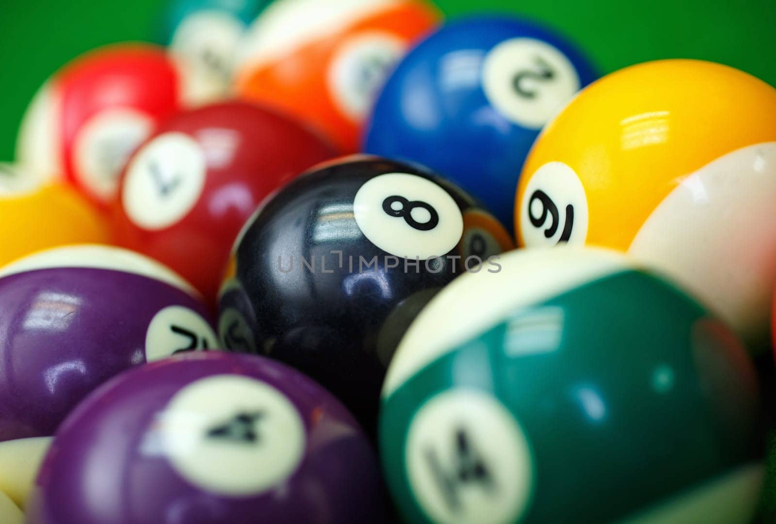 Different points of view billiard balls on a blue pool table.
