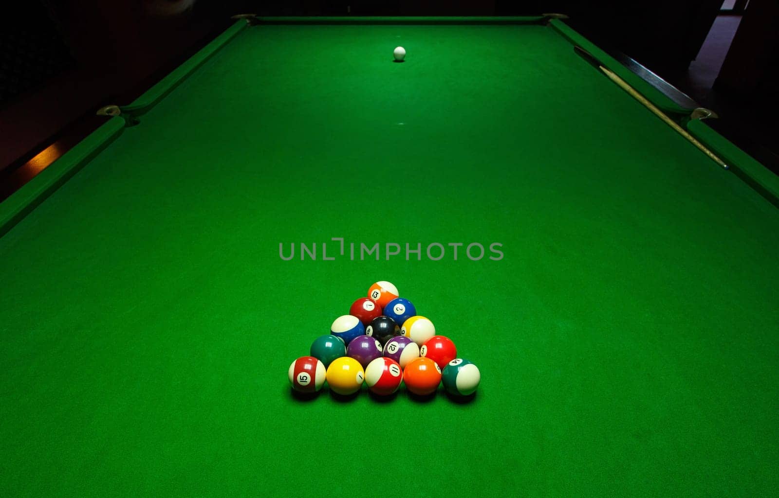 Billards pool game. Green cloth table with coloful balls