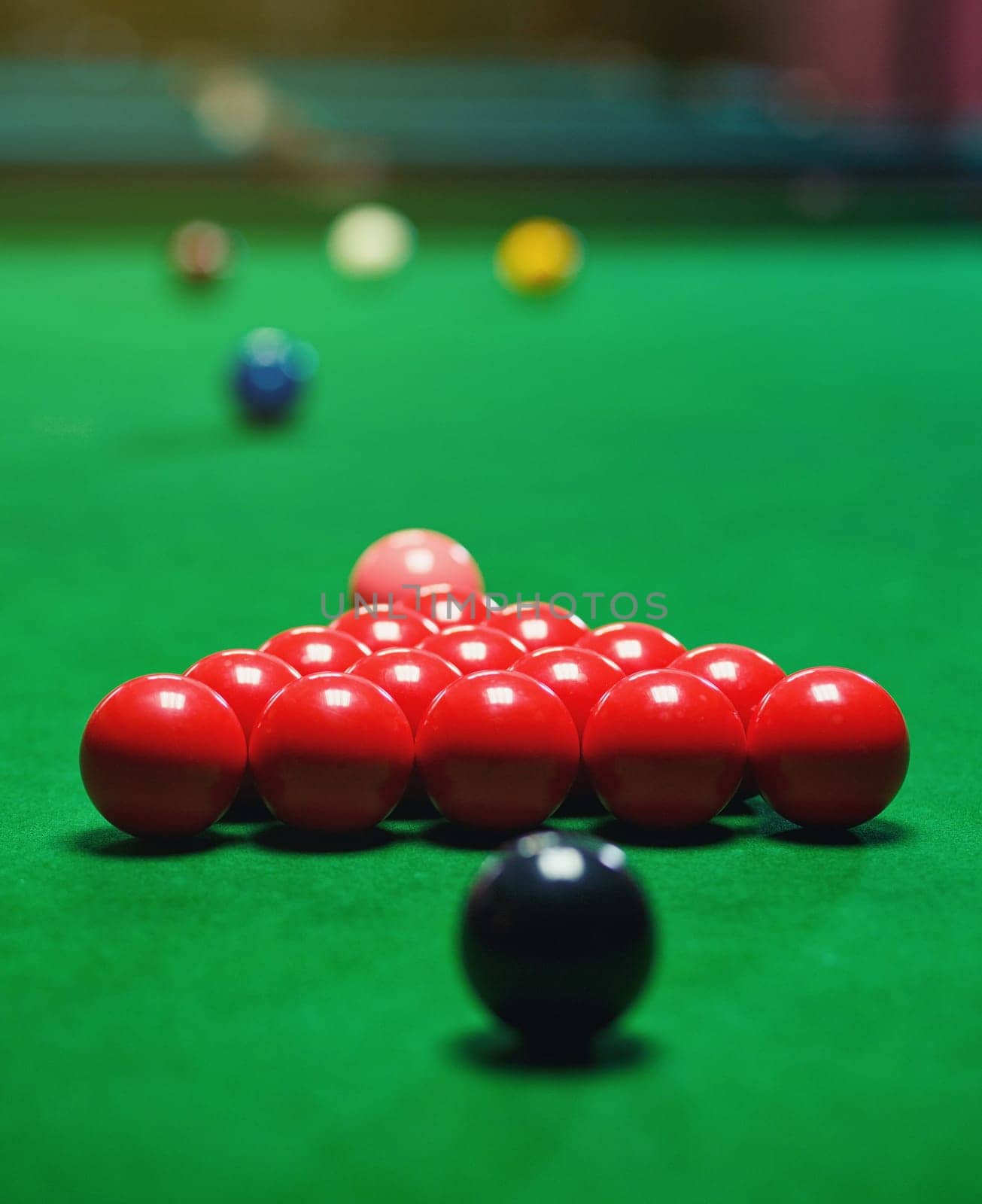 red snooker balls set on a green table, billiards game