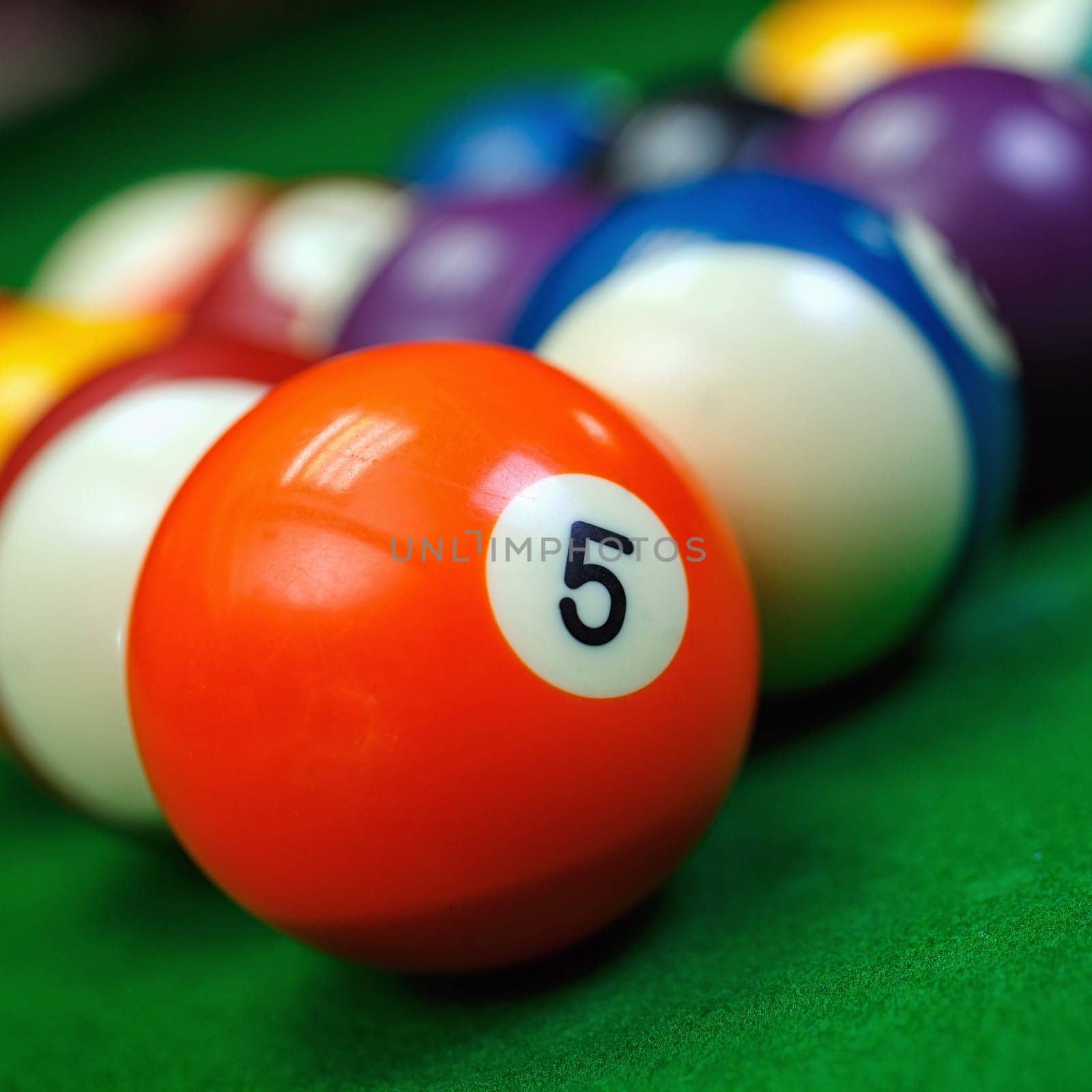 Different points of view billiard balls on a blue pool table.