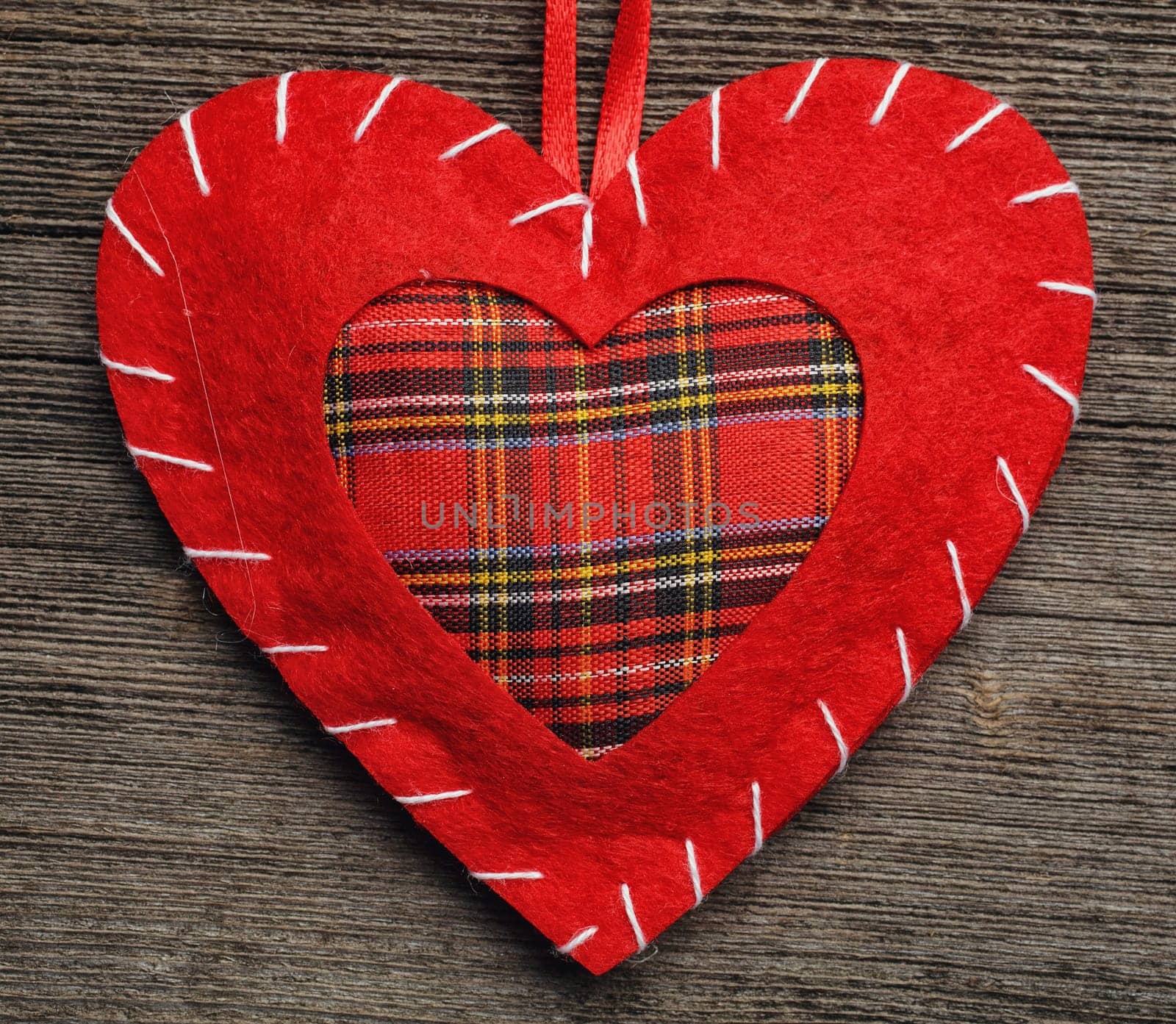 Valentine day heart pillow on wooden background