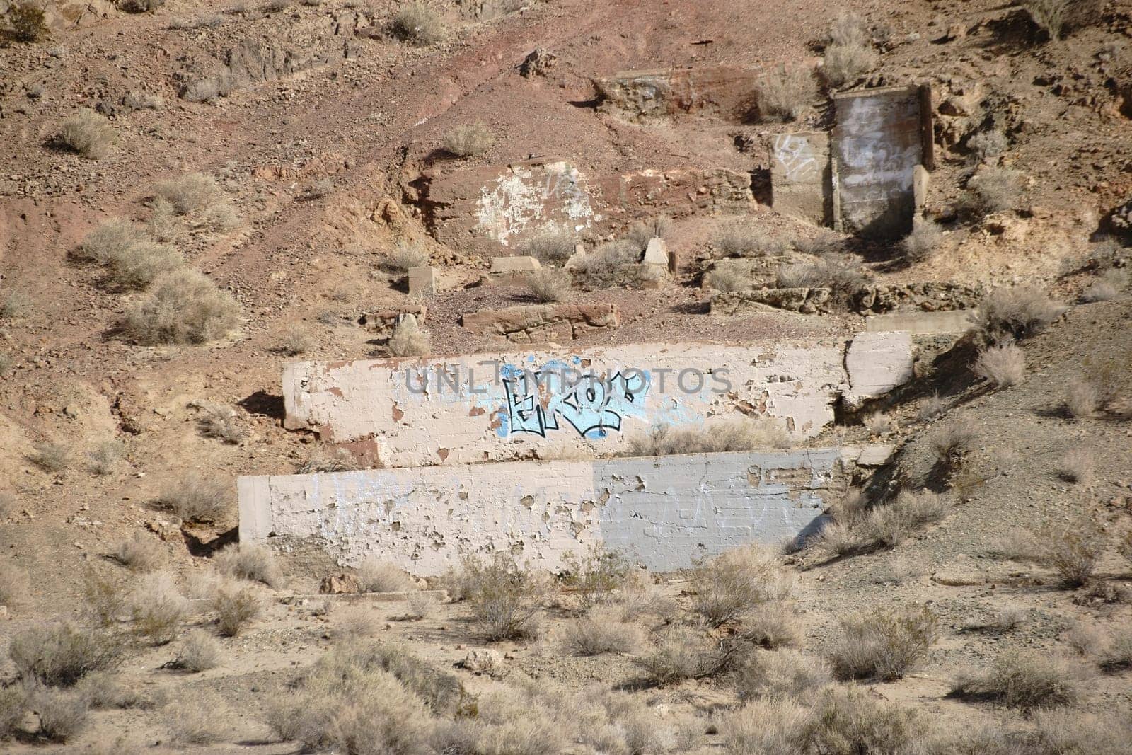 The remains of a house and its foundations in the middle of the desert.