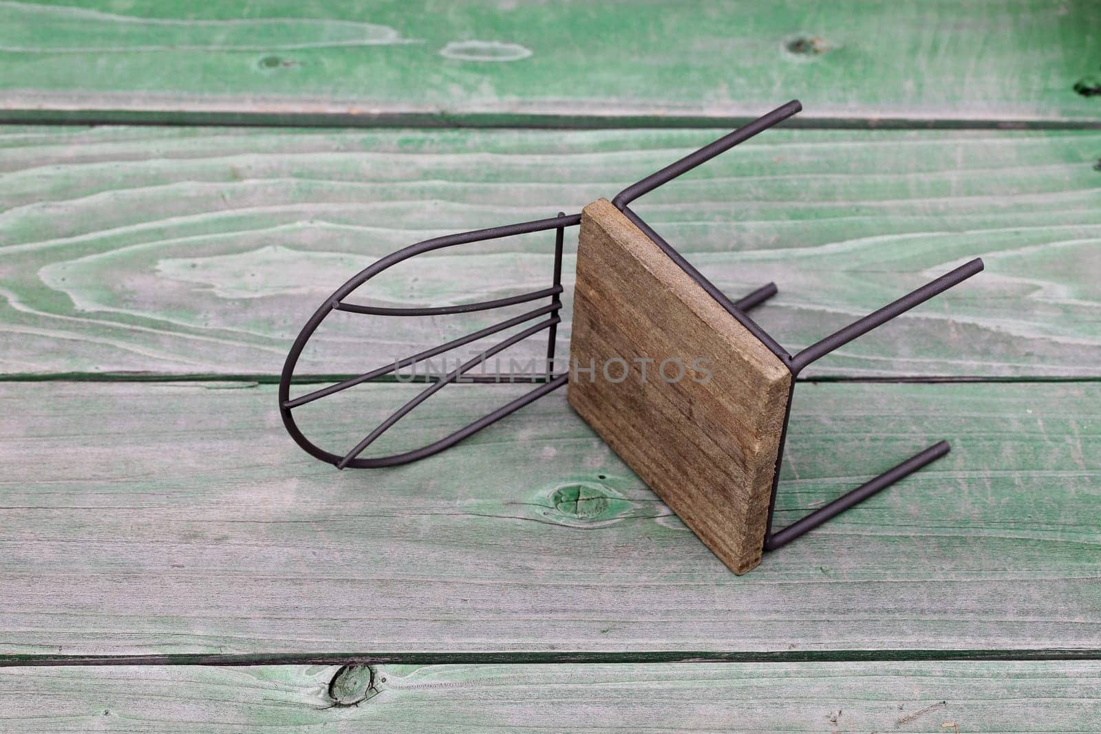 small toy chair on grunge wood background