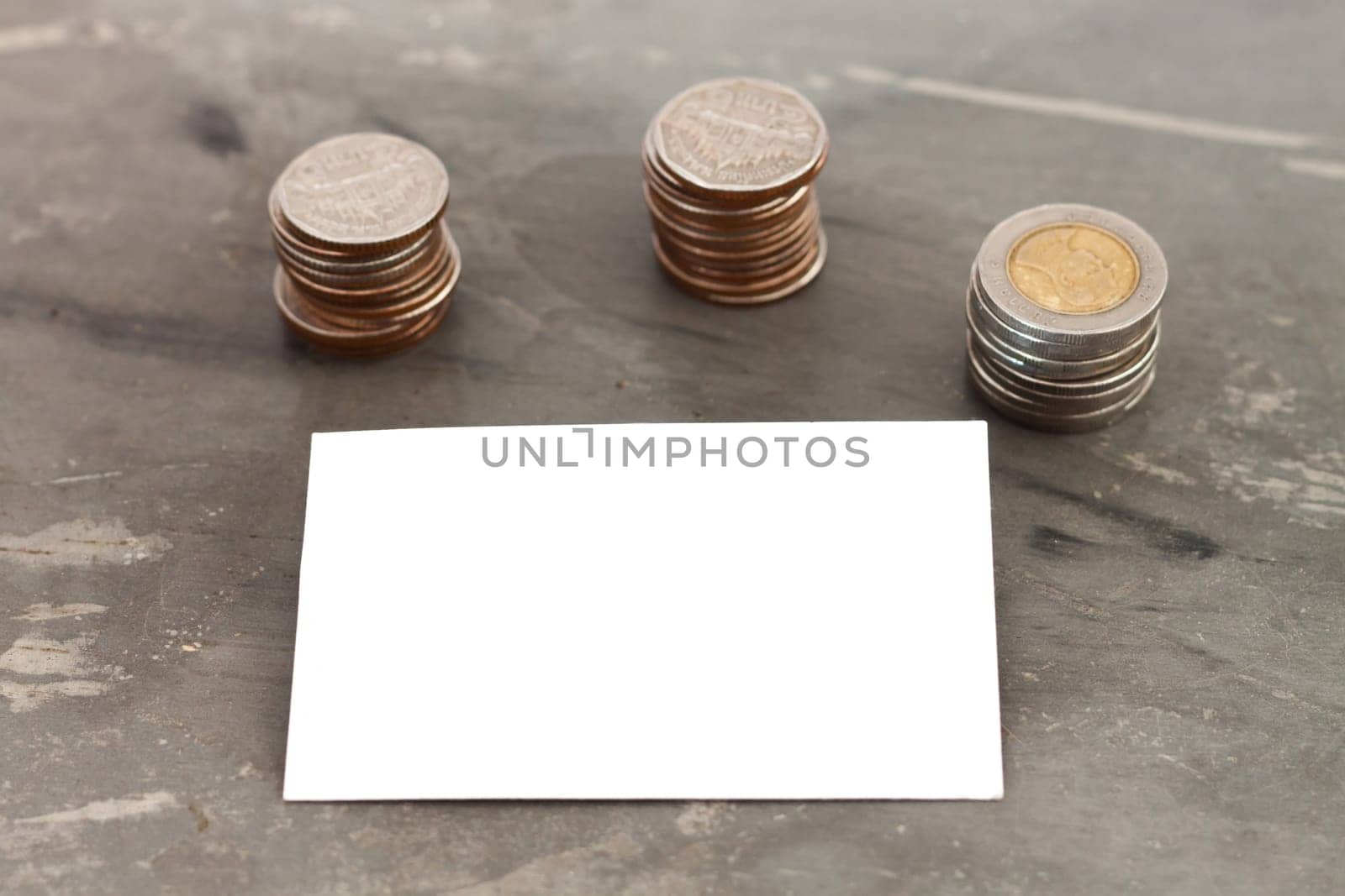 Blank name card with coins, stock photo