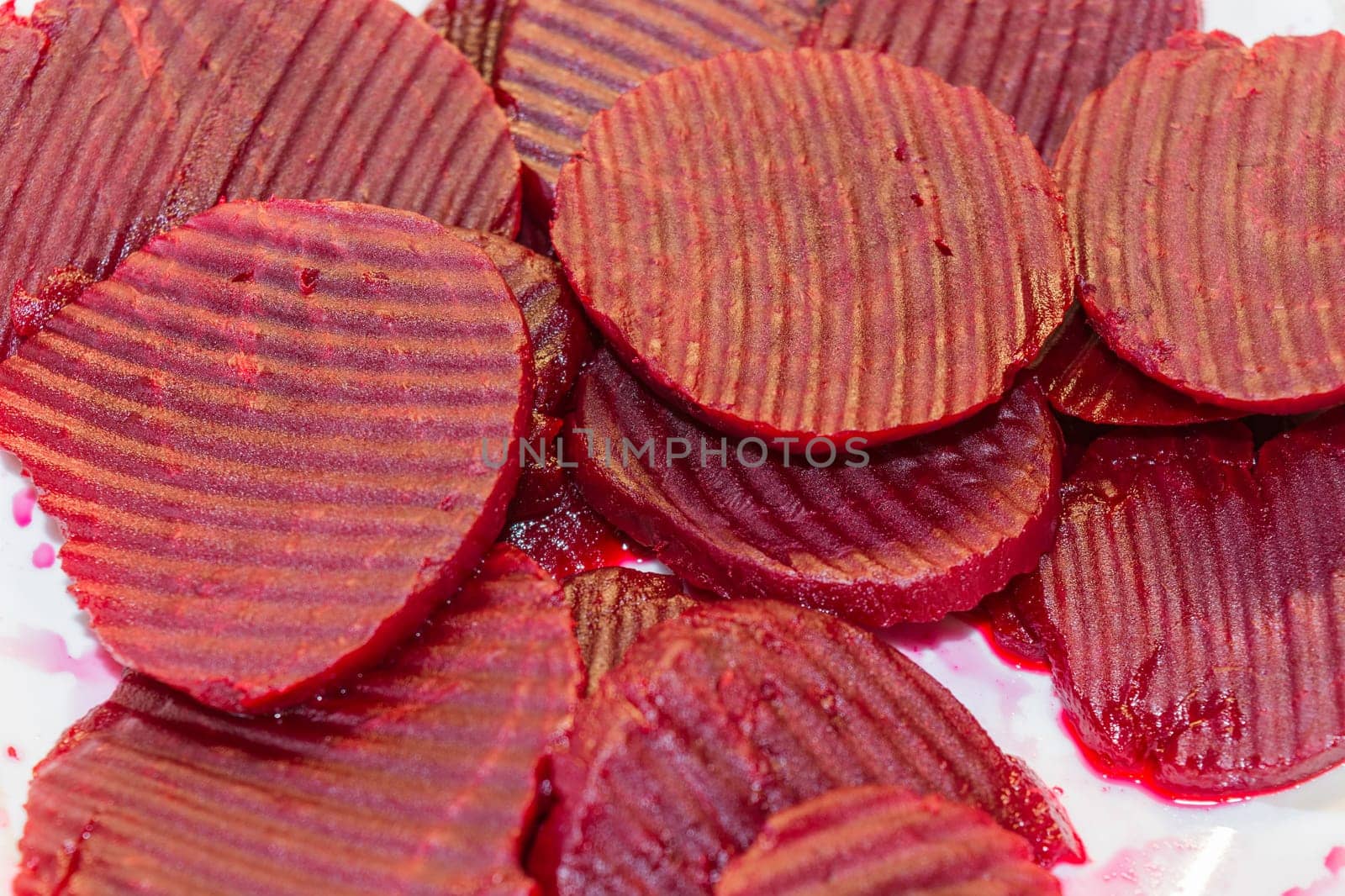 Beetroot discs close-up isolated on white background.