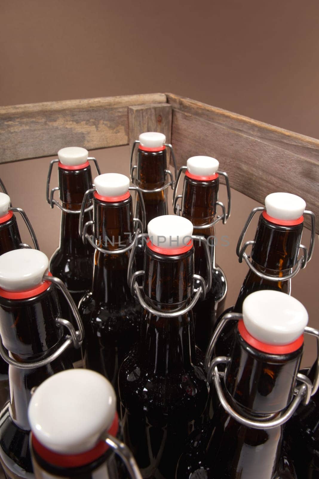 Close-up of many beer bottles with ironing closure in old beer box