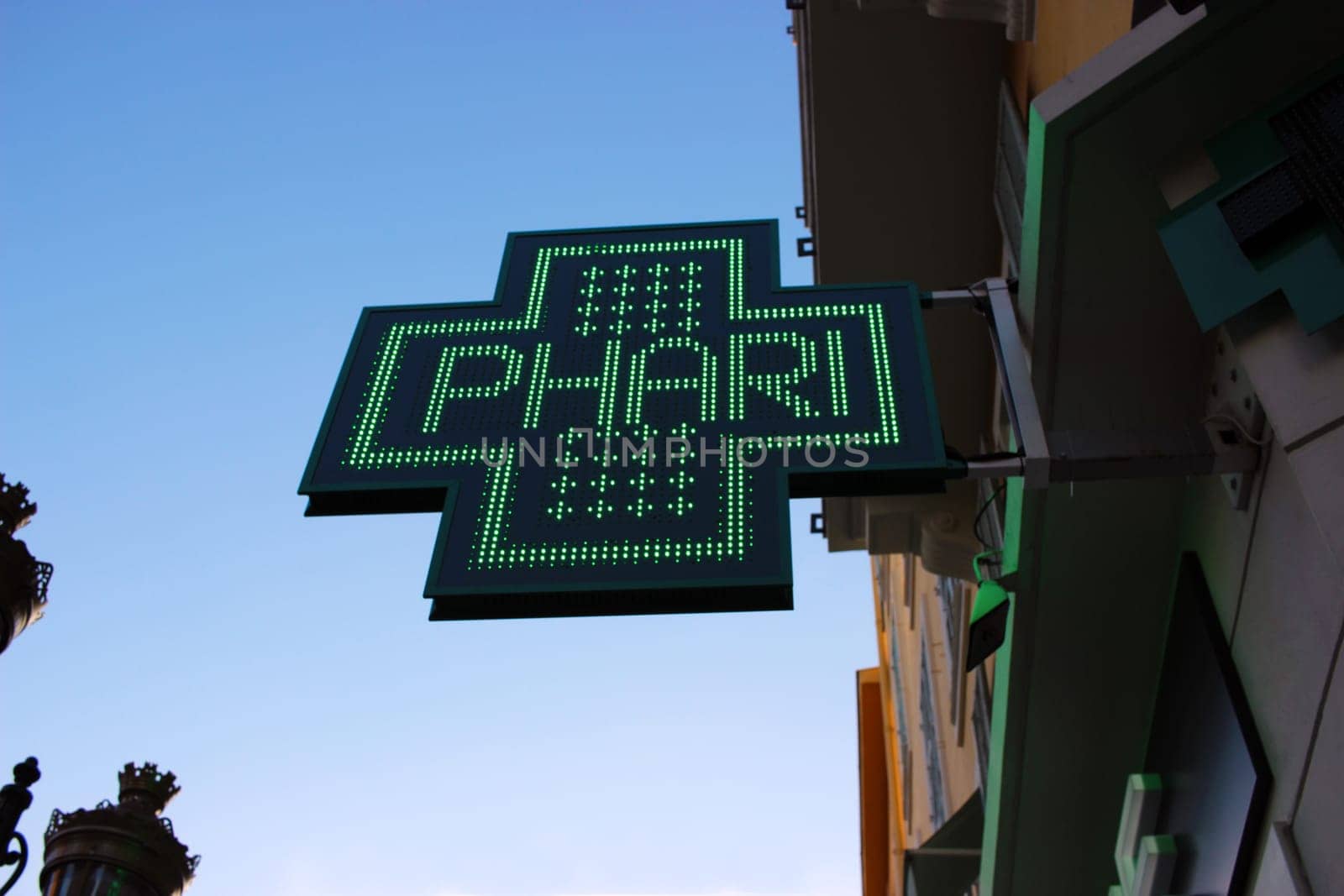 Neon Green Cross Sign Close-up