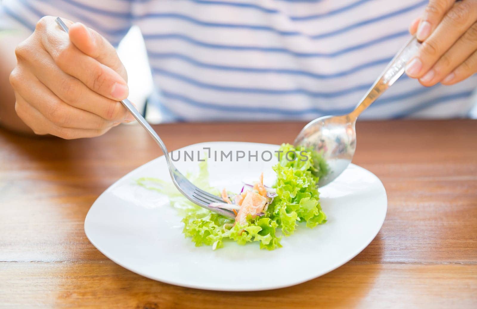 women eating fresh healthy salad