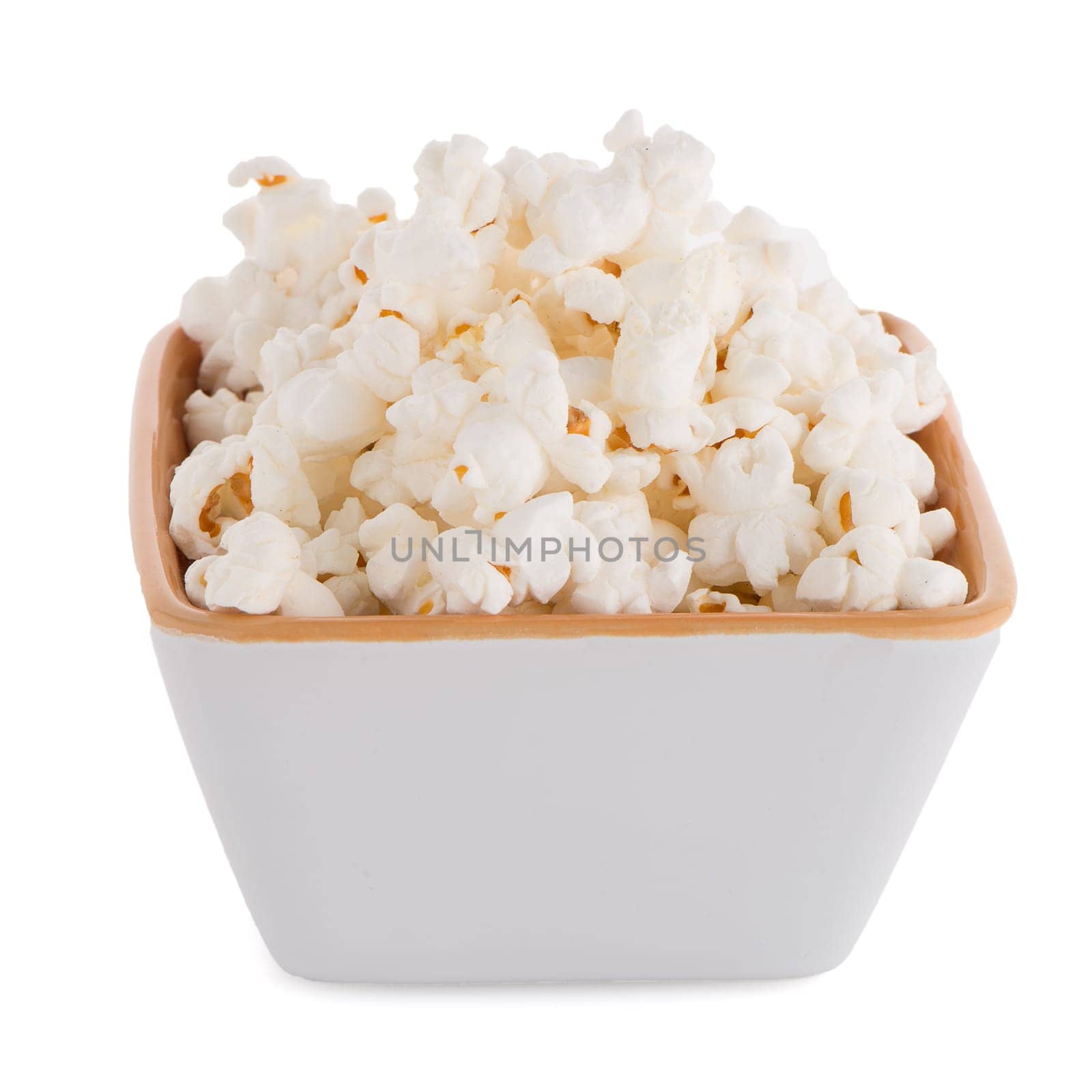 Popcorn in a white bowl on a white background