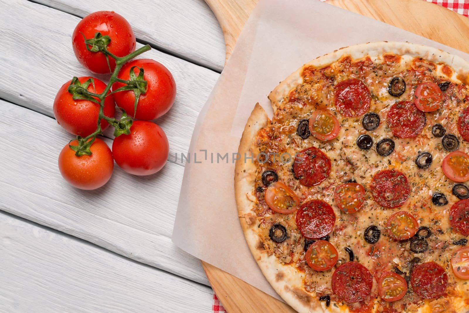 Italian pizza served on wooden table, close-up.